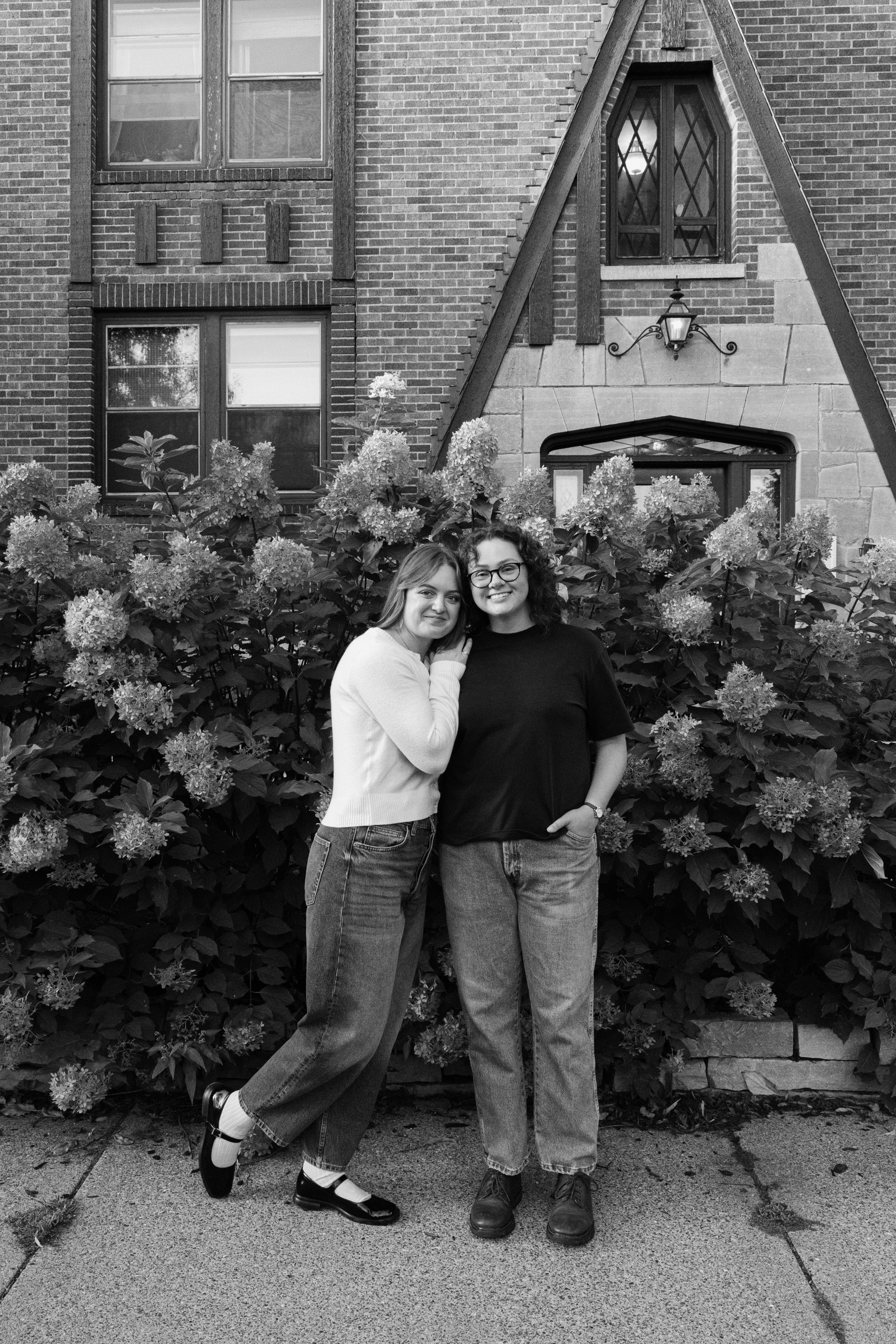 Polaroid photo of a couple posing together on a bed with the date 06/10/19 written on the polaroid.